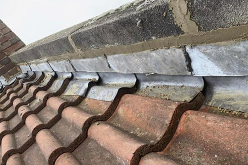 Residential Roof repair of interlocking tiles.