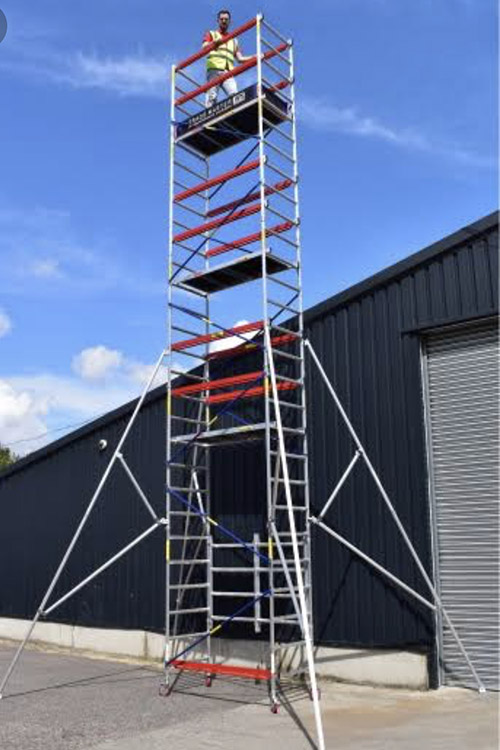 Scaffolding used with man at the top